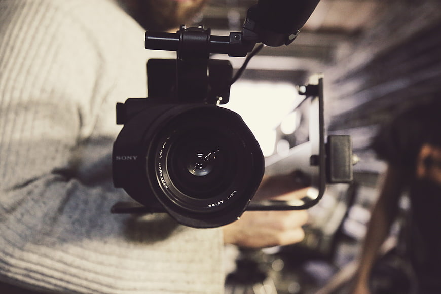 Close-up of Sony video camera lens on gimbal stabilizer