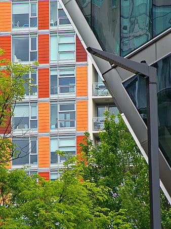 Modern Orange and Green Apartment Building Facade
