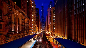Chicago 'L' Train Station at Night with City Skyline