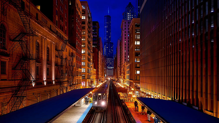 Chicago 'L' Train Station at Night with City Skyline