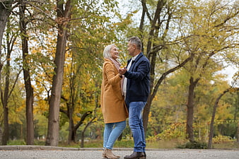 Happy Senior Couple Dancing in Autumn Park