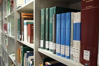 Medical Books on White Library Shelf
