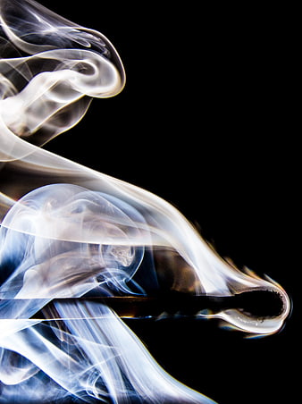 Burning Match with Swirling Smoke on Black Background