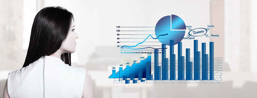 Businesswoman analyzing blue financial charts and graphs
