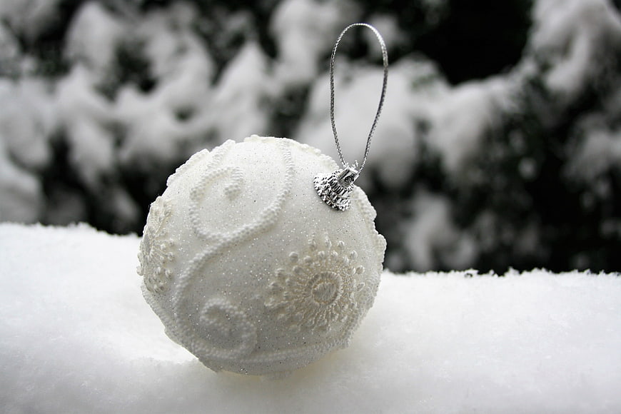 White textured Christmas ornament in snow