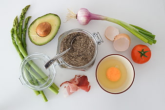 Flat lay of fresh healthy breakfast ingredients on white background