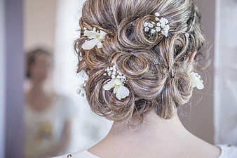 Bridal updo hairstyle with white flowers and baby's breath