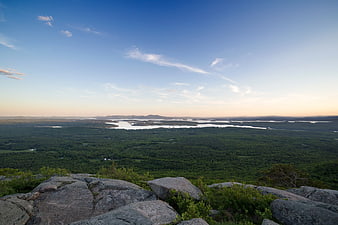 Panoramic View of Forest and Lakes from Rocky Cliff