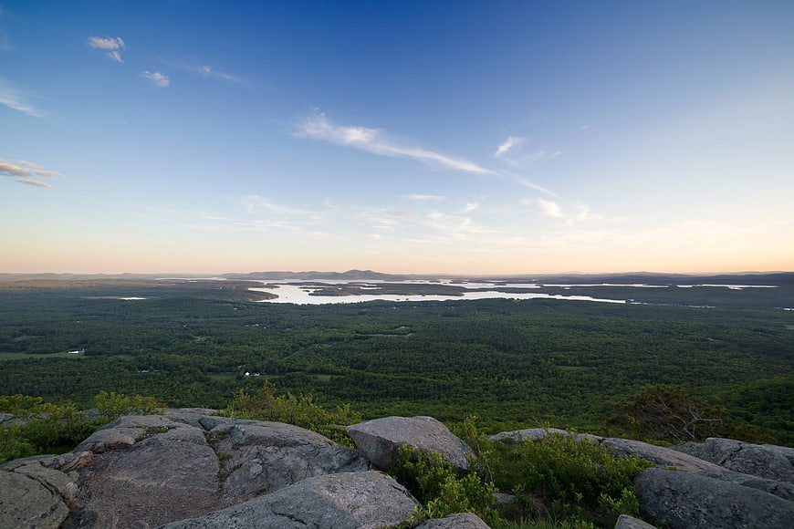Panoramic View of Forest and Lakes from Rocky Cliff