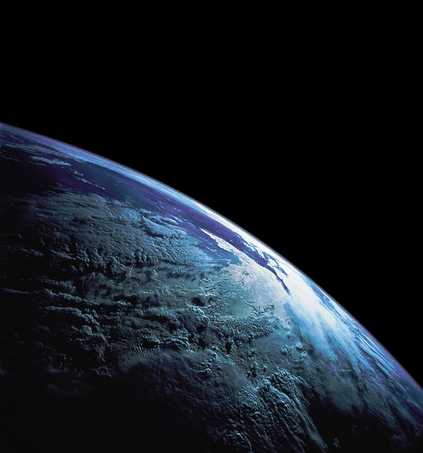 Earth Horizon from Space with Blue Atmosphere and Clouds