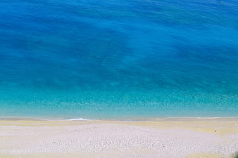 Aerial View of Turquoise Sea and White Sandy Beach
