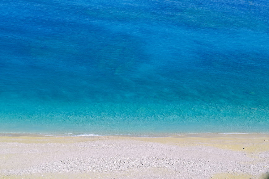 Aerial View of Turquoise Sea and White Sandy Beach