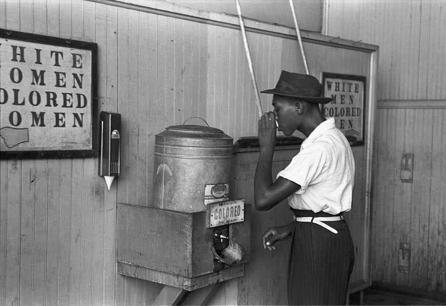 Historical Black and White Photo of Racial Segregation at Drinking Fountain