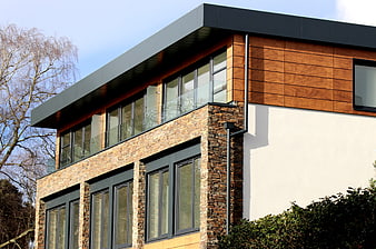 Modern House Exterior with Stone, Wood, and Glass