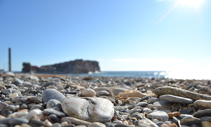 Close-up of pebbles on a sunny Mediterranean beach