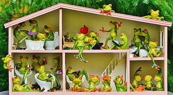 Cute Green Frogs Living in a Pink Dollhouse