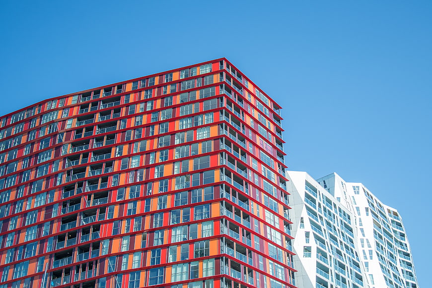 Modern Colorful Apartment Building Against Blue Sky