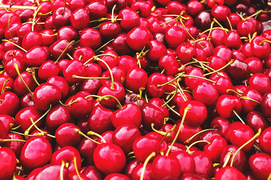 Vibrant Fresh Cherries With Green Stems Filling Frame