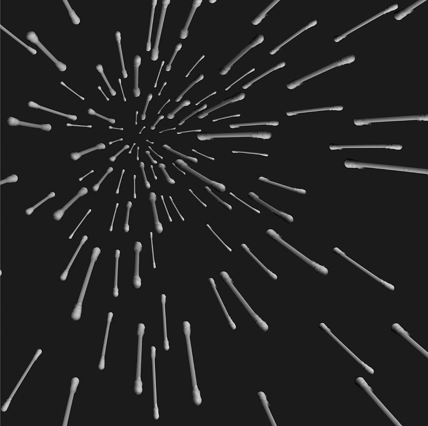 White cotton swabs exploding on black background