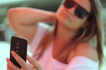 Woman Taking Selfie with Smartphone Outdoors