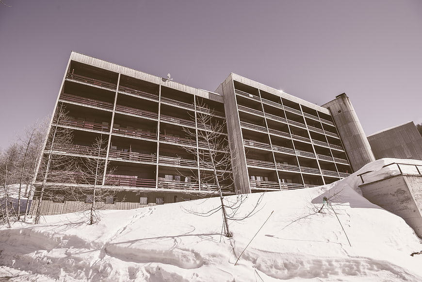 Modern Concrete Apartment Building in Snowy Winter Landscape