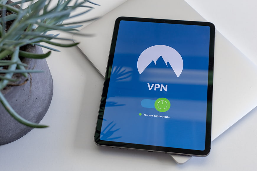Tablet displaying VPN connection interface on white desk