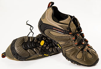 Tan Merrell Hiking Shoes on White Background