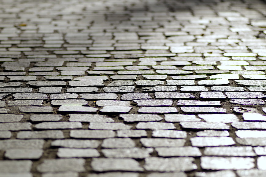 Close-up of gray cobblestone pavement texture
