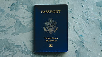 US Passport on Textured Blue Surface