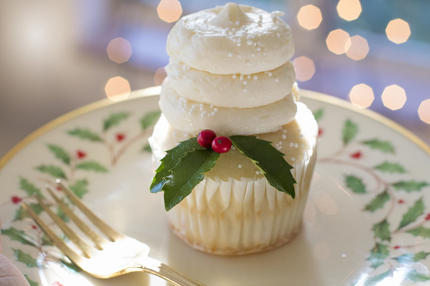 Festive Christmas Cupcake with Holly on Patterned Plate