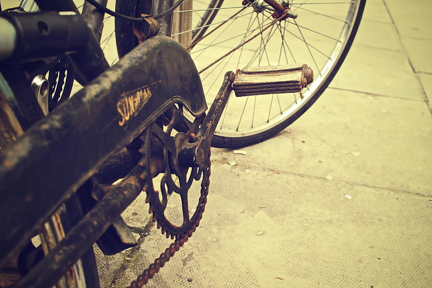 Close-up of vintage rusty bicycle chain and pedal