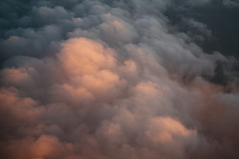 Dramatic sunset clouds with warm orange and dark blue tones
