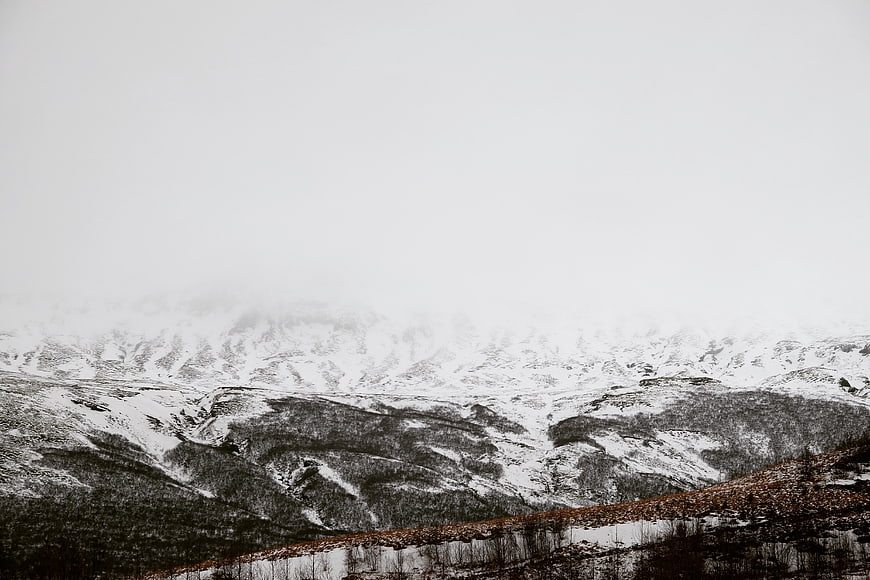 Snowy Mountain Landscape with Fog and Mist