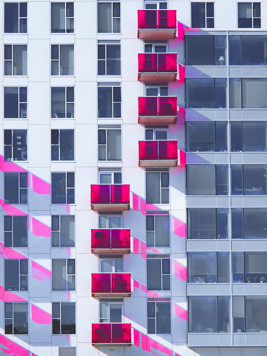 Modern Apartment Building with Vibrant Pink Balconies