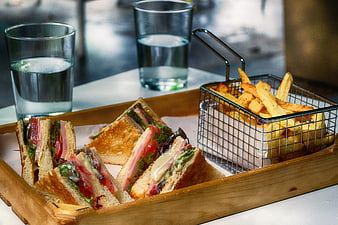 Club Sandwich and Fries on Wooden Tray