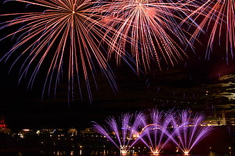 Spectacular Fireworks Display Over City Skyline at Night