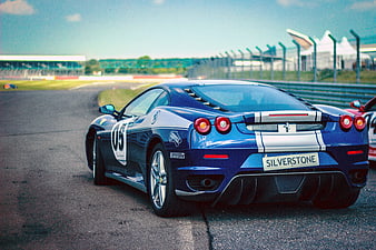 Blue Ferrari 458 Italia Racing Car on Silverstone Track