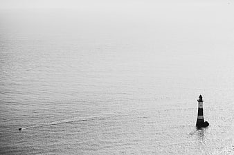 Minimalist Black and White Lighthouse in the Ocean