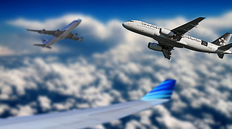 Air New Zealand Airplane Flying Above Clouds With Blue Winglet