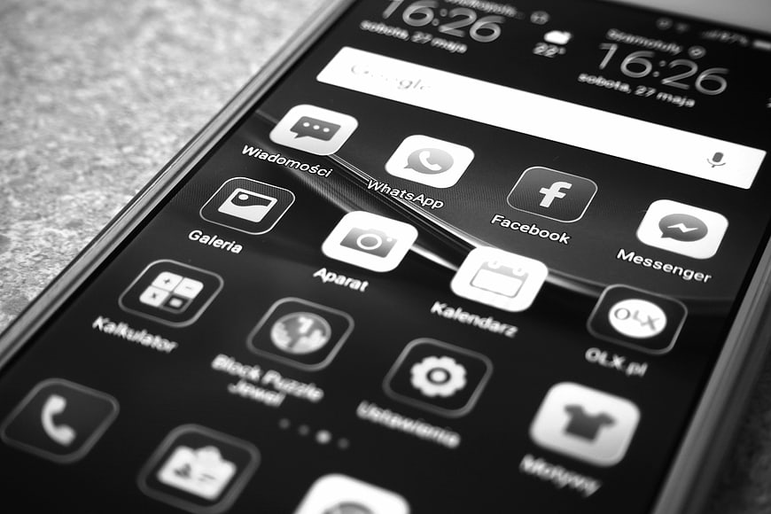 Close-up of Smartphone Screen with App Icons in Black and White