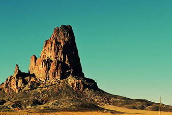 Dramatic Red Rock Butte Against Teal Sky