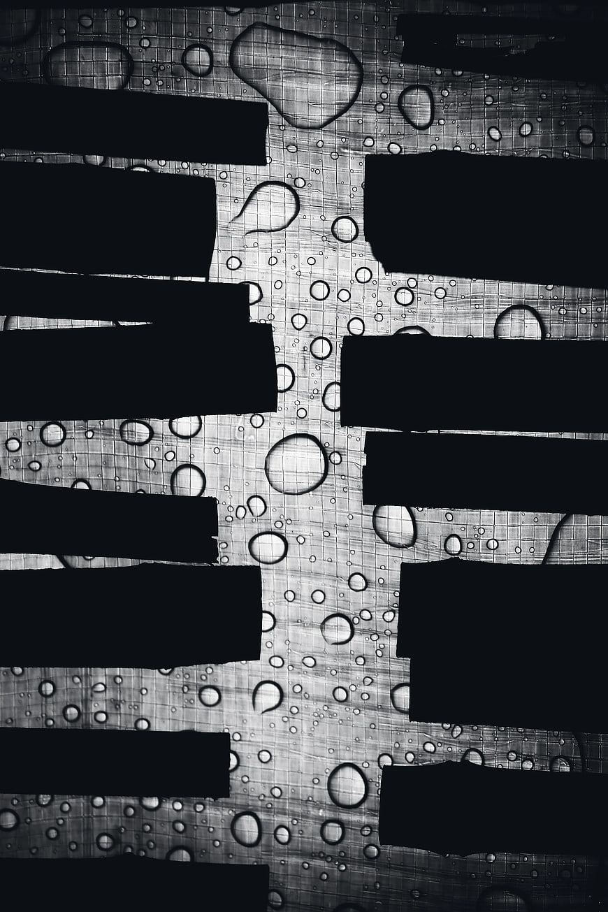 Abstract black and white water droplets on textured background