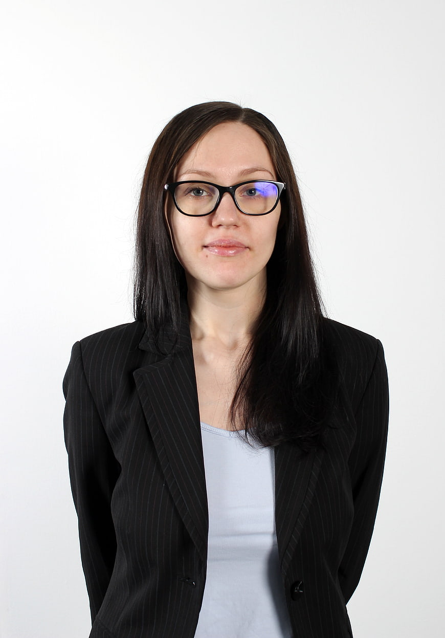 Professional Portrait of Business Woman Wearing Glasses and Black Blazer