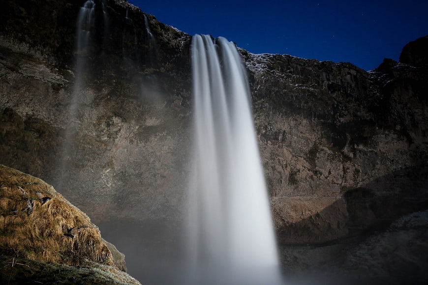 Long Exposure Waterfall at Night with Starry Sky