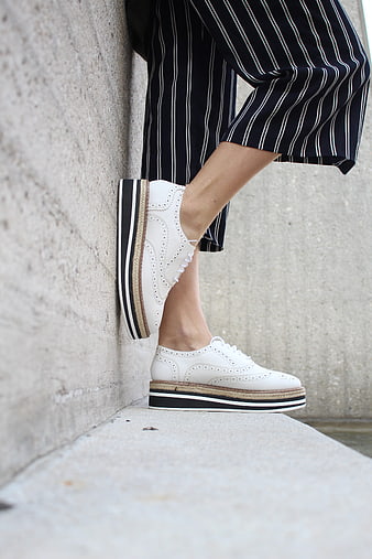 White Platform Brogue Sneakers With Striped Trousers