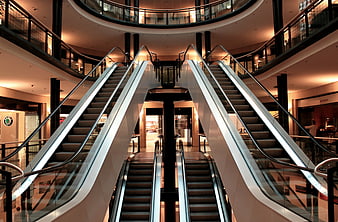 Symmetrical Escalators in Modern Shopping Mall Interior