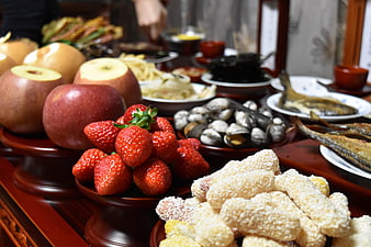 Traditional Chinese New Year Eve Feast with Strawberries and Apples