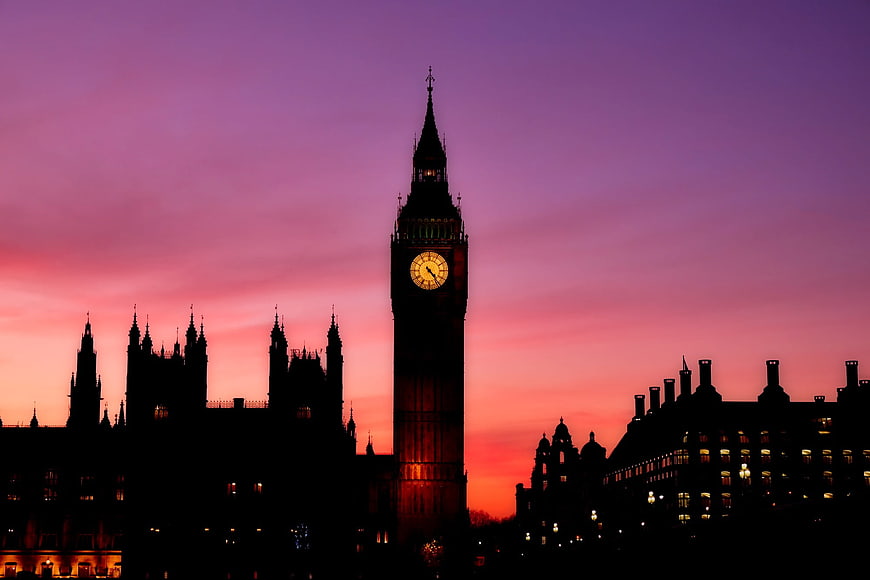 Big Ben Silhouette Against Vibrant Pink and Purple Sunset Sky
