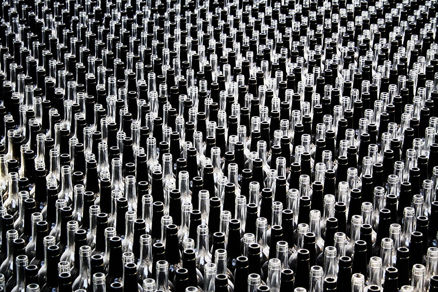 Massive Array of Empty Glass Bottles in Industrial Rows