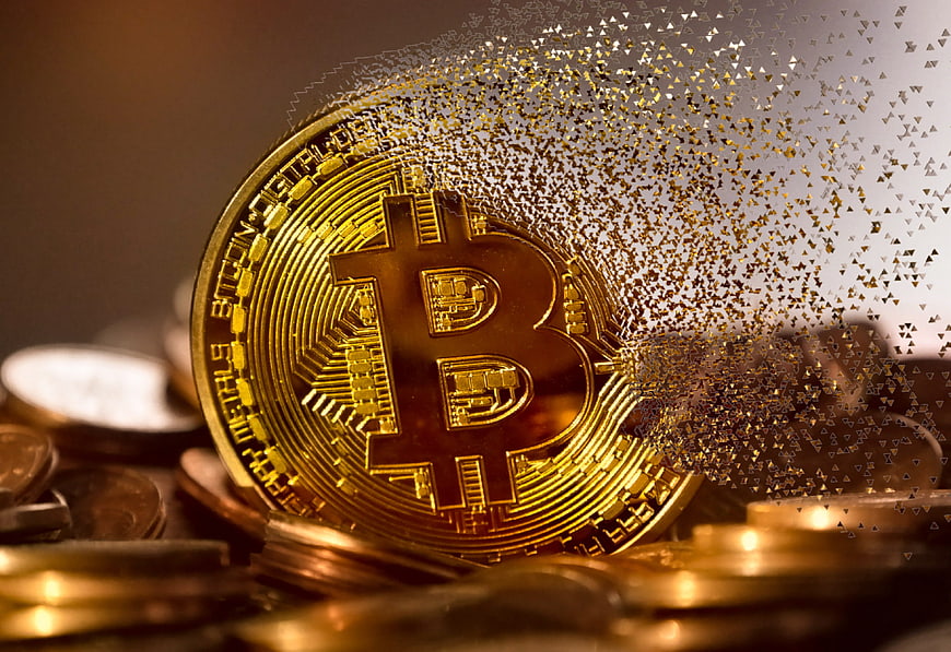 Golden Bitcoin Coin Disintegrating into Digital Particles